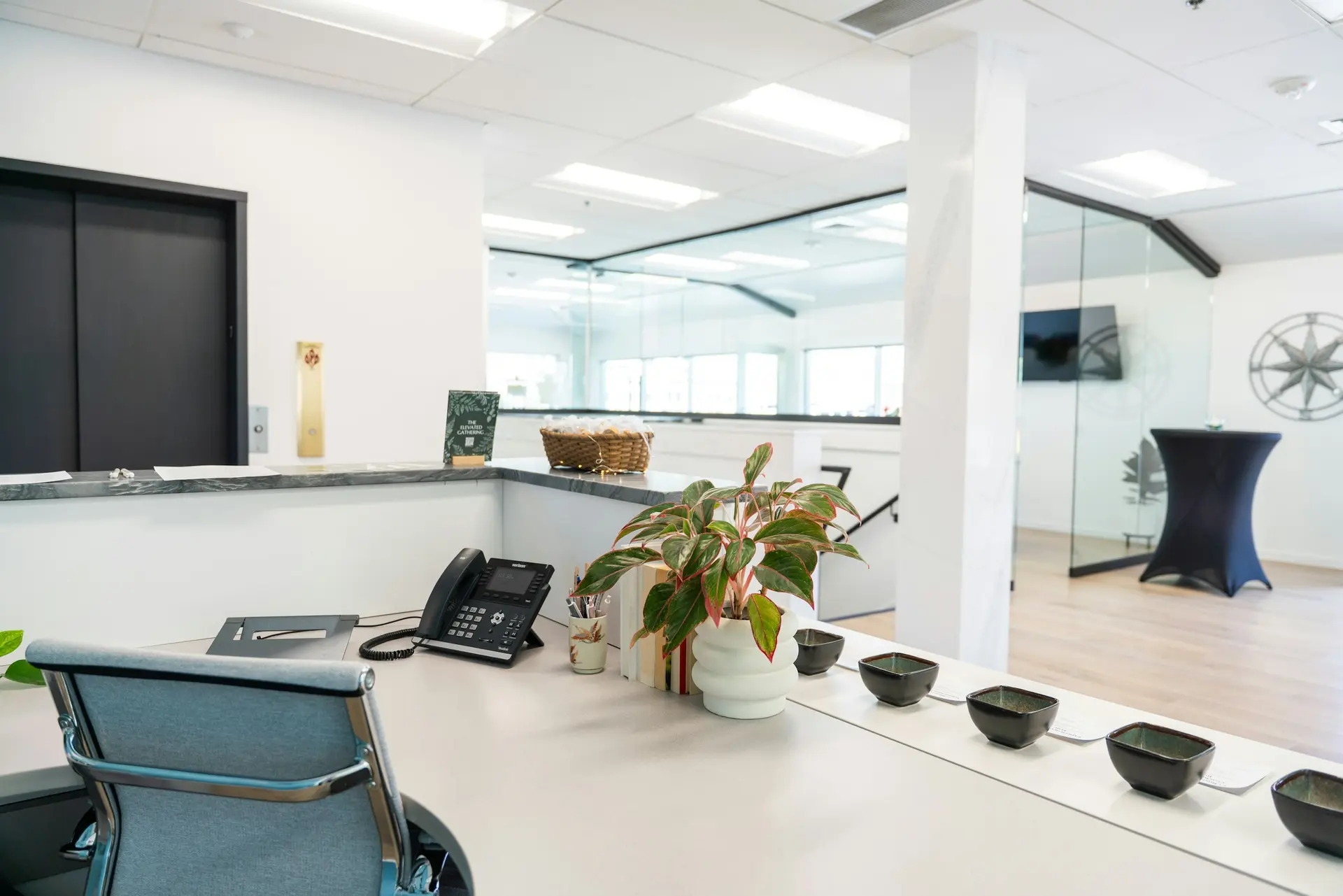Corporate office interior with desks and a restrained material palette
