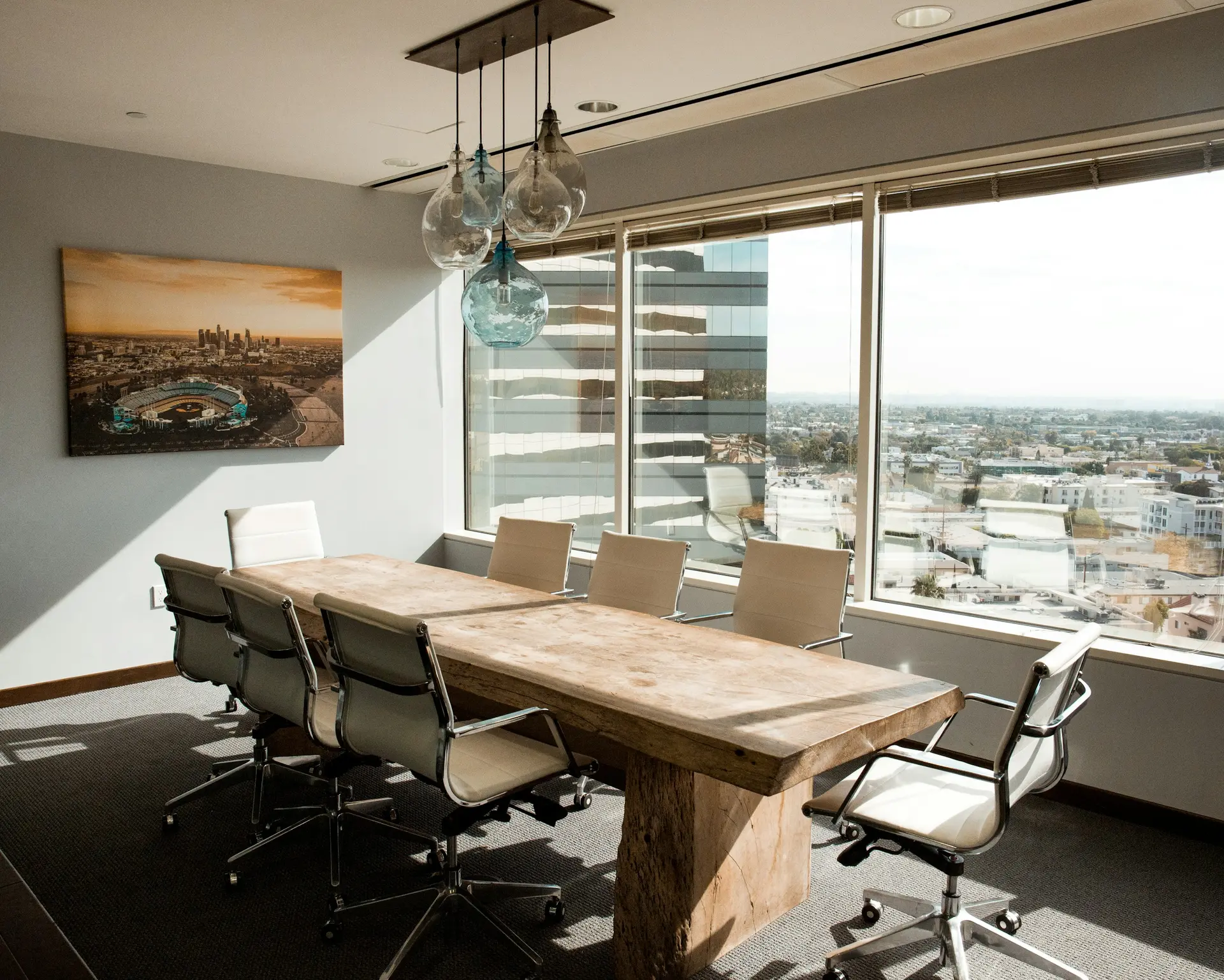 Glazed office partitions separating a meeting room from the working floor