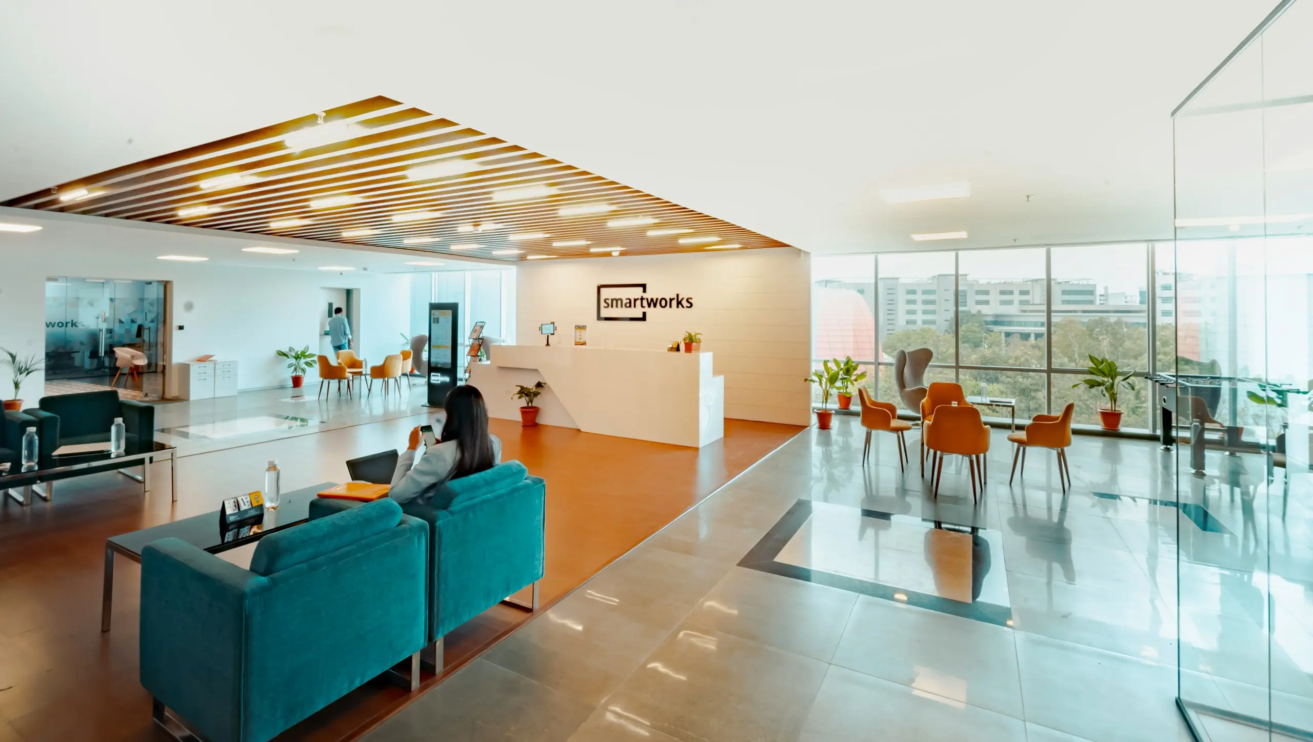 Modern commercial office reception with a desk and visitor arrival
